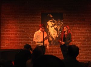 Ryan Alpers and Julia Halprin Jackson read the prologue to "The End of Time" by Cellista at Cafe Strtich, January 6, 2016. Photo by Leo Alvarez.