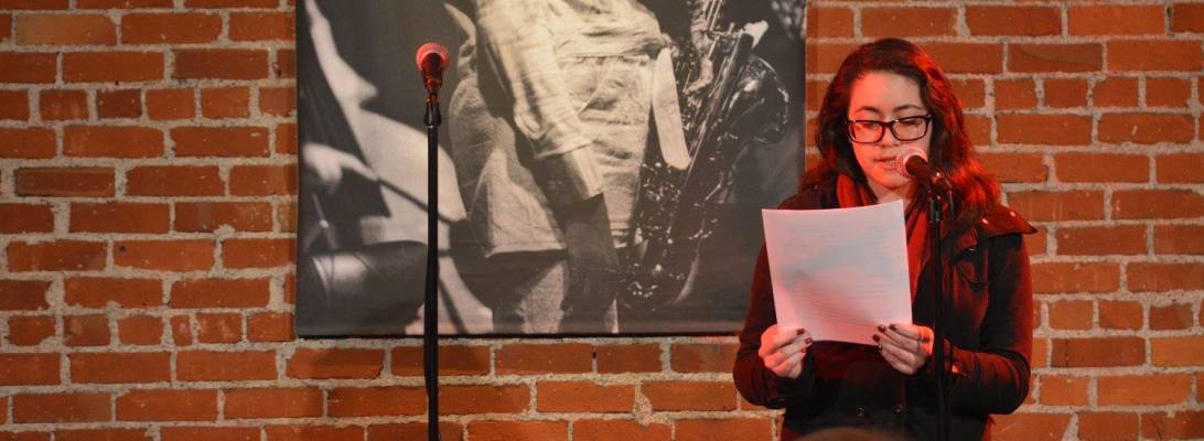 Ivette Deltoro reads "Suck it Up" by Tania Martin at Cafe Stritch. Photo by Andrew Christian.